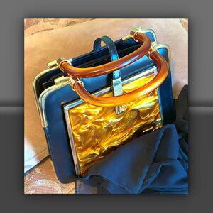Black Leather Handbag with Amber Swirl Lucite Handles and Panel
